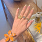 Orange Floral Grace Ring And Bracelet Set